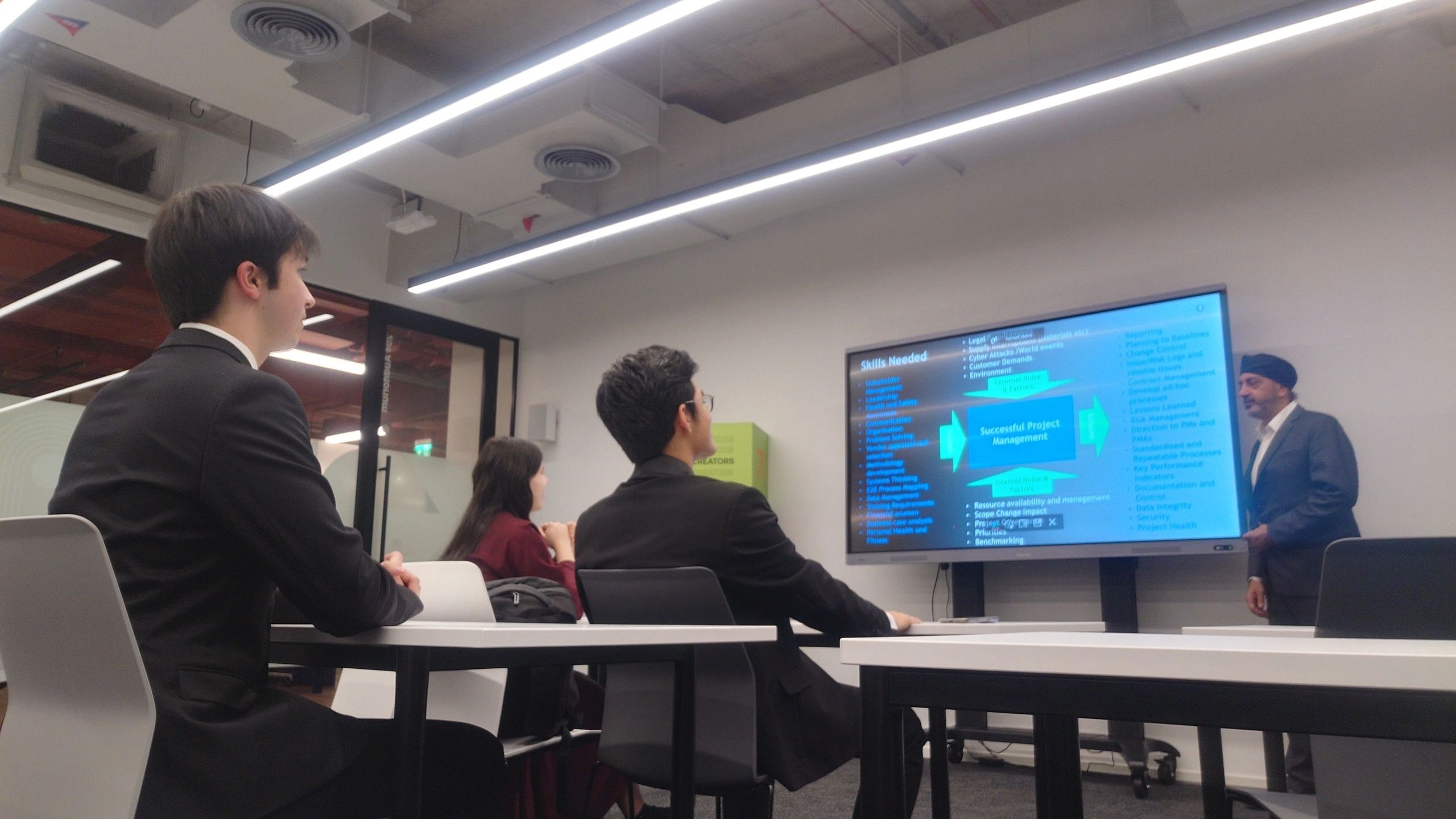 Indy Bahra leading a project management workshop with students